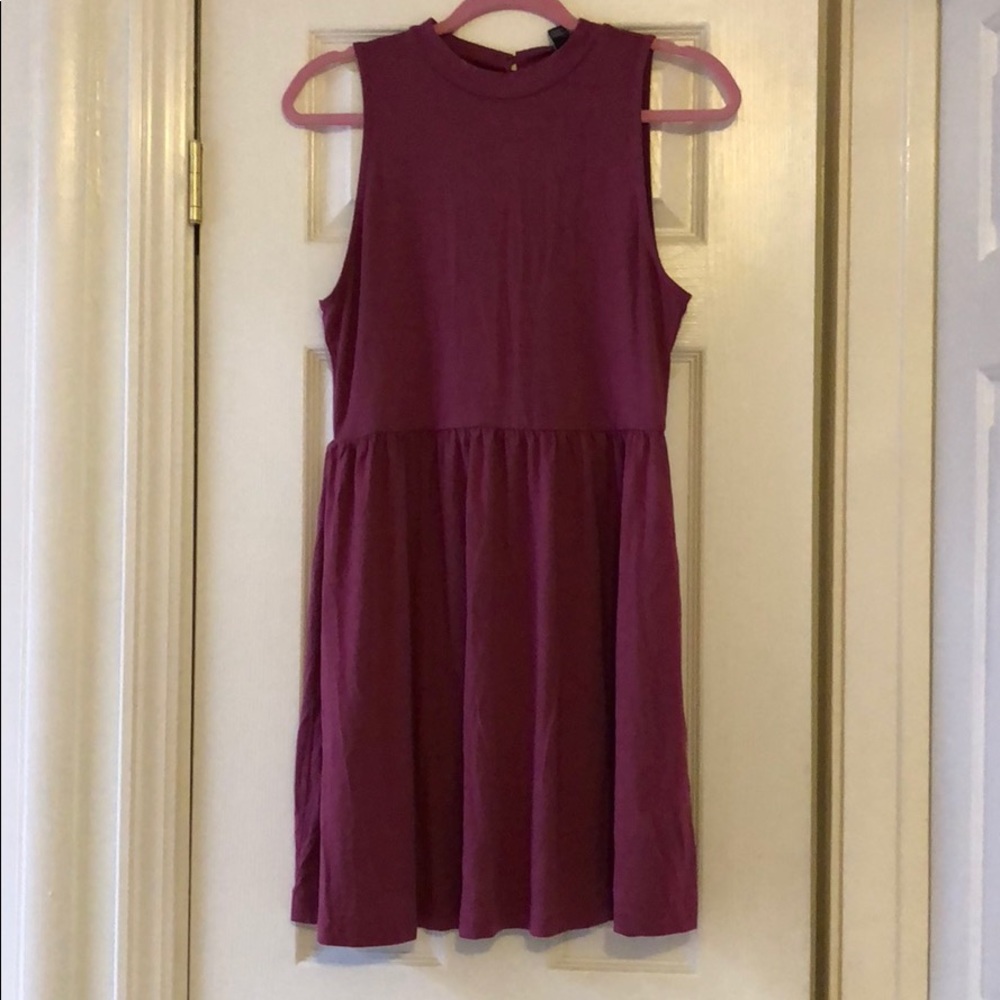 High collar open back dress.